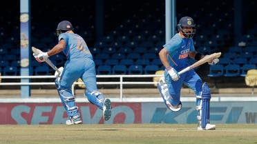 India captain Virat Kohli (right), and Rohit Sharma, run between the wickets during their second One-Day International cricket match against West Indies in Port of Spain, Trinidad, on August 11, 2019. (AP)