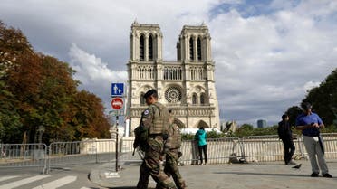 French soldiers clear the area around Notre Dame cathedral in Paris, Monday, Aug. 12, 2019.  (AP)