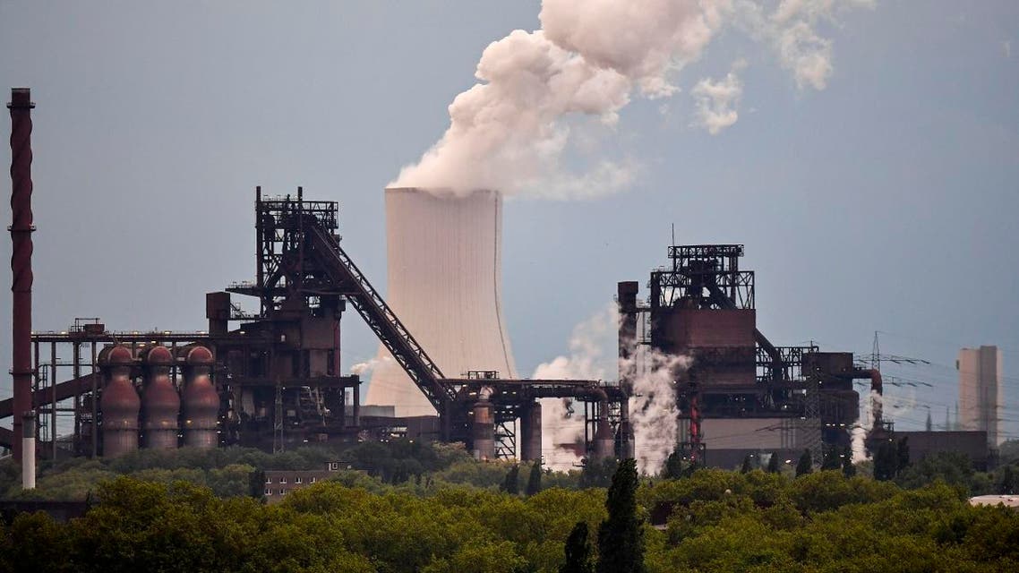 A power plant steams behind steel works of German steelmaker Thyssenkrupp in Duisburg, Germany, on May 9, 2019. (AP)