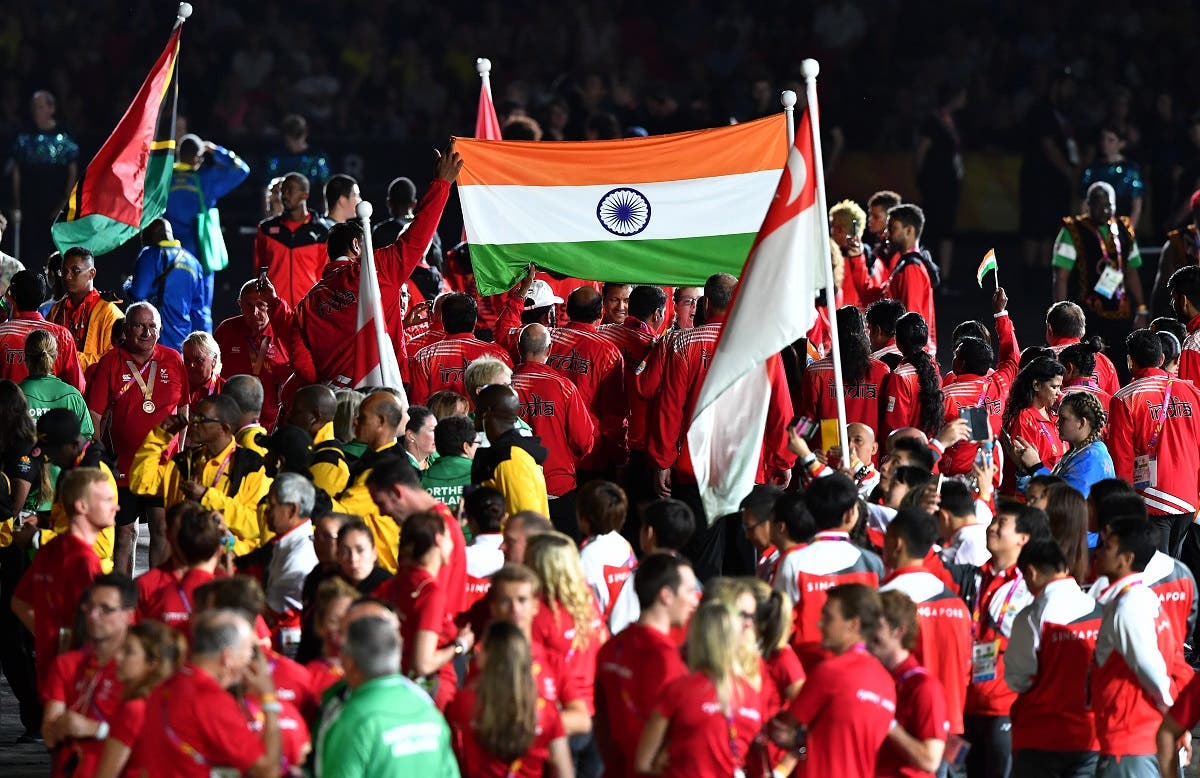 India’s flag is seen among athletes during the closing ceremony of the 2018 Gold Coast Commonwealth Games at the Carrara Stadium on the Gold Coast on April 15, 2018. (AFP)