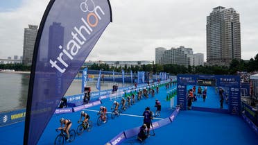 Athletes compete during a women's triathlon test event at Odaiba Marine Park, a venue for marathon swimming and triathlon at the Tokyo 2020 Olympics, Thursday, Aug. 15, 2019, in Tokyo. (AP)