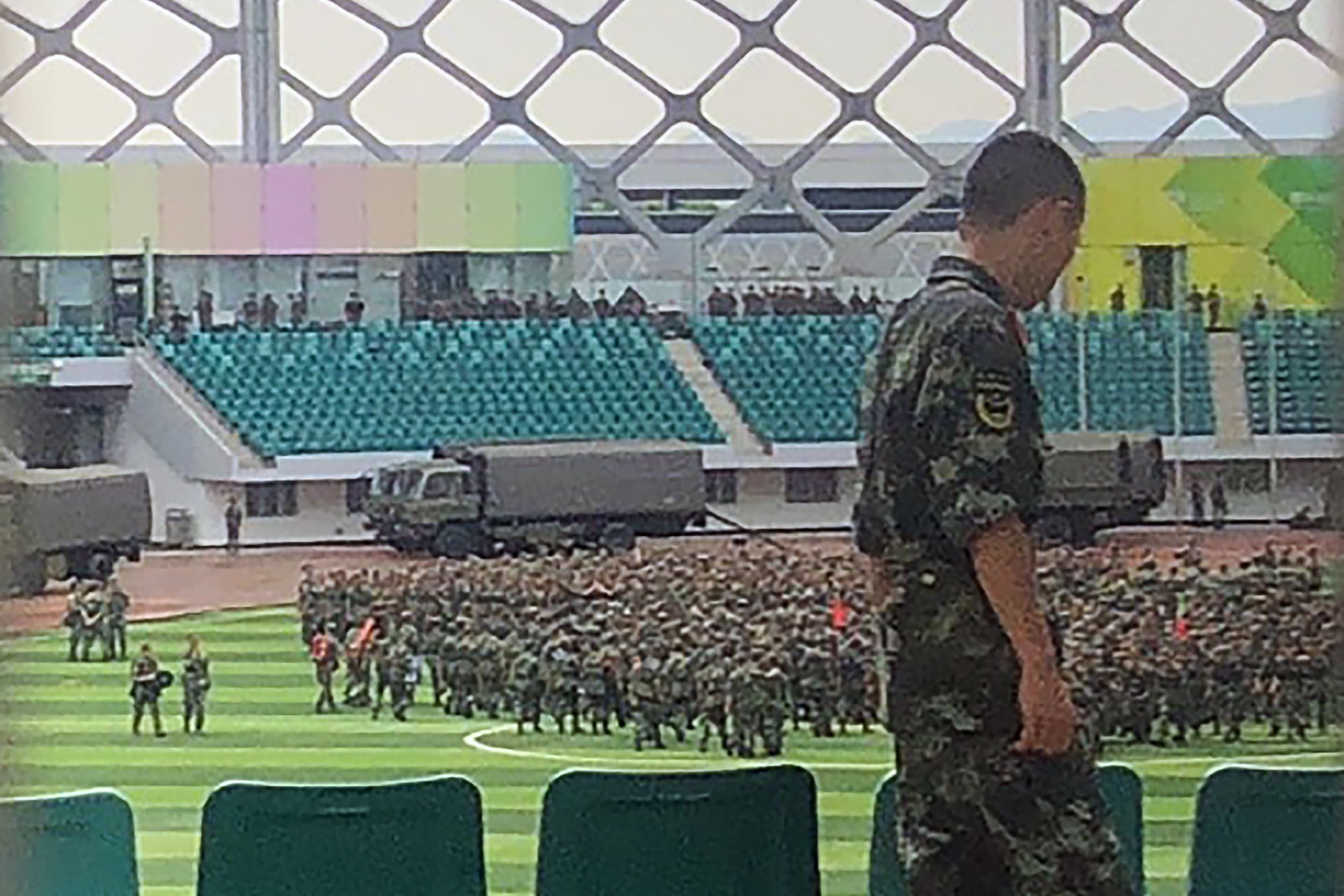 Chinese military personnel gather at the Shenzhen Bay stadium in Shenzhen, bordering Hong Kong in China's southern Guangdong province, on August 15, 2019. (AFP)