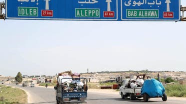 A picture taken on May 6, 2019 shows a truck loaded with belongings of a family as they flee from reported regime shelling on the southern countryside of the rebel-held Idlib province. (AFP)