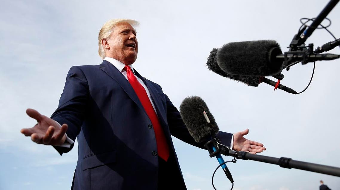 President Donald Trump speaks with reporters before boarding Air Force One at Morristown Municipal Airport in Morristown, N.J., Thursday, Aug. 15, 2019, en route to a campaign rally in Manchester, N.H. (AP)
