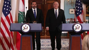 US Secretary of State Mike Pompeo shakes hands with Lebanese Prime Minister Saad Hariri after they spoke to members of the media at the State Department on August 15, 2019, in Washington, DC. (AFP)