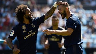 Real Madrid's French forward Karim Benzema (R) celebrates with Real Madrid's Brazilian defender Marcelo. (AFP) 
