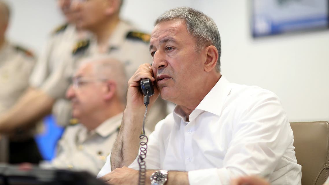 A handout picture taken and released on May 28, 2019 by the Turkish Defence Ministry shows Turkish Chief of General Staff Hulusi Akar conducting a counter-terror operation in Northern Iraq's Hakurk district with the attendance of Commander of the Turkish Land Forces Yasar Guler (not seen) and other commanders during night time in Ankara.