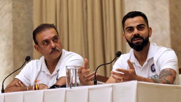 Indian cricket team coach Ravi Shastri (left), looks on as captain Virat Kohli addresses a press conference ahead of the team’s departure to West Indies in Mumbai, India, on July 29, 2019. (AP)