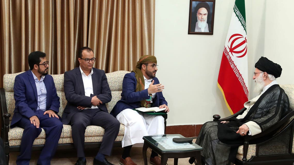 A handout picture provided by the office of Iran's Supreme Leader Ayatollah Ali Khamenei on August 13, 2019 shows him (R) meeting with Mohammed Abdul-Salam (C), spokesman for Yemen's Huthi rebels, during their meeting at Khamenei's residence in the capital Tehran.