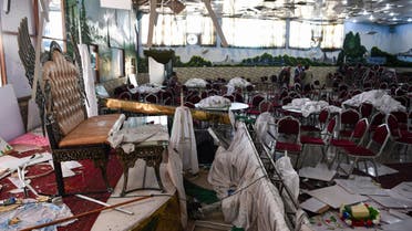 Afghan men investigate in a wedding hall after a deadly bomb blast in Kabul on August 18, 2019. (AFP)