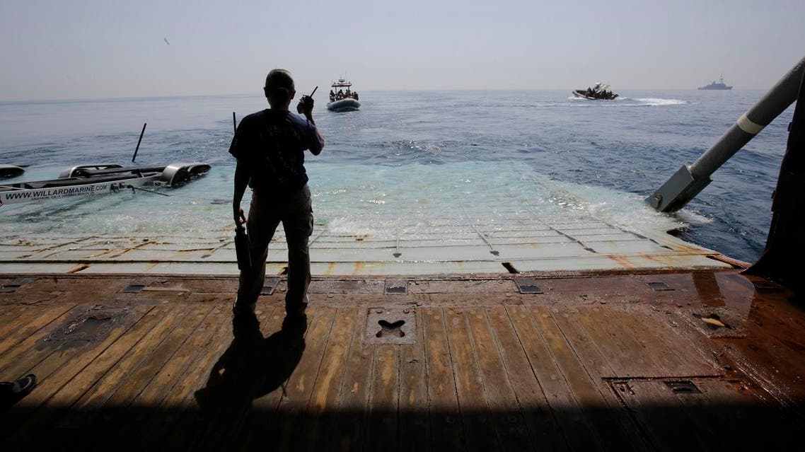 A US Navy sailor assists during training exercises with small boats coming and going from the USS Ponce. (File photo: AP)