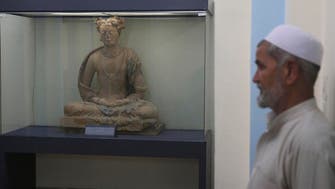 Afghans restore art shattered by Taliban as peace deal nears