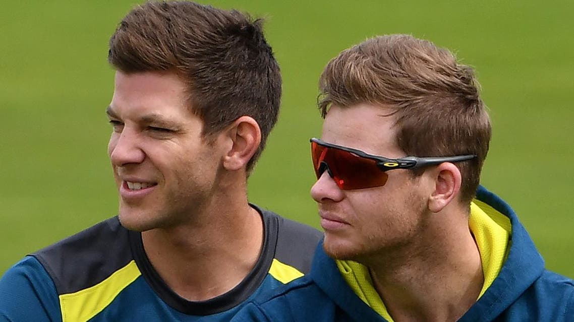 Australia’s captain Tim Paine (L) and Steve Smith watch teammates during a practice session at Headingley Stadium in Leeds, northern England, on August 21, 2019 on the eve of the start of the third Ashes cricket Test. (AFP)
