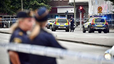 Police stand next to a cordon in central Malmo, southern Sweden, Monday, June 18, 2018. (AP)