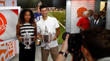 Novak Djokovic of Serbia and Naomi Osaka of Japan hold their winners trophies at NBC's TODAY Show on September 10, 2018 in New York City. (AFP)