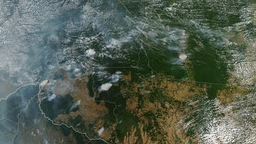 A NASA Earth Observatory image shows several fires burning in the Brazilian states of Amazonas on August 11, 2019, while Bolivia appears on the left bottom of the image. (AFP)