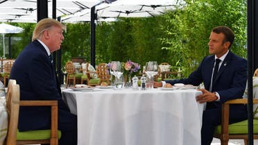 US President Donald Trump (L) at lunch with French President Emmanuel Macron at the Hotel du Palais in Biarritz, south-west France on August 24, 2019, on the first day of the annual G7 Summit. (AFP)