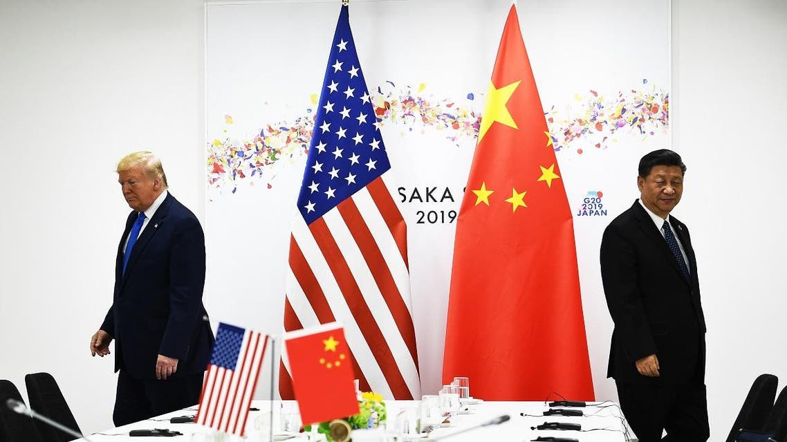 In this file photo taken on June 29, 2019, Chinese President Xi Jinping (R) and US President Donald Trump attend their bilateral meeting on the sidelines of the G20 Summit in Osaka. (AFP)