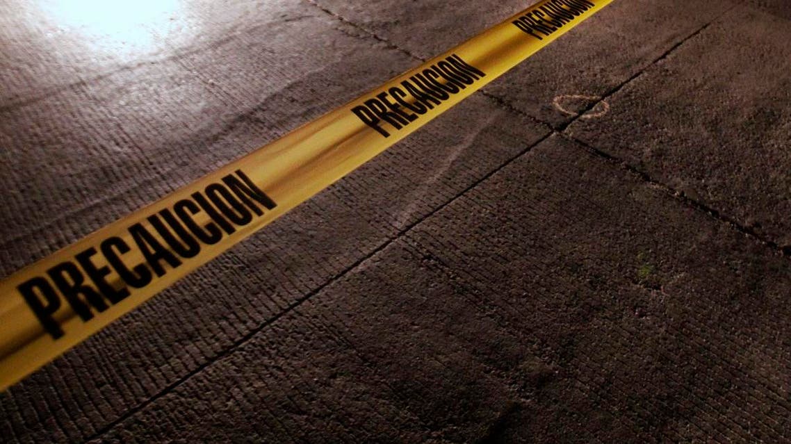 A police tape surrounds the crime scene where a man was killed in Tijuana, Mexico, late Monday, Aug. 10, 2009. (AP)