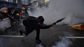Hong Kong police fire water cannon at protesters for first time