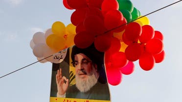 Balloons with a picture of Lebanon's Hezbollah leader Sayyed Hassan Nasrallah hang in the air during a rally. (Reuters)