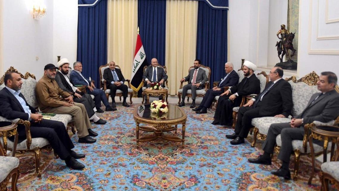 This handout photograph released by the Iraqi President’s Office on August 26, 2019, shows (L to R) MP and spokesman for Hashed al-Shaabi. (AFP)