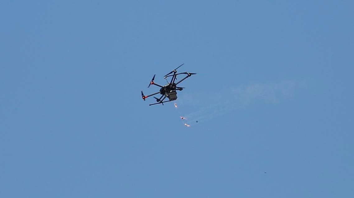 A drone used by Israeli troops fires teargas at Palestinians during a demonstration near the Gaza Strip border with Israel. (File photo: AFP)
