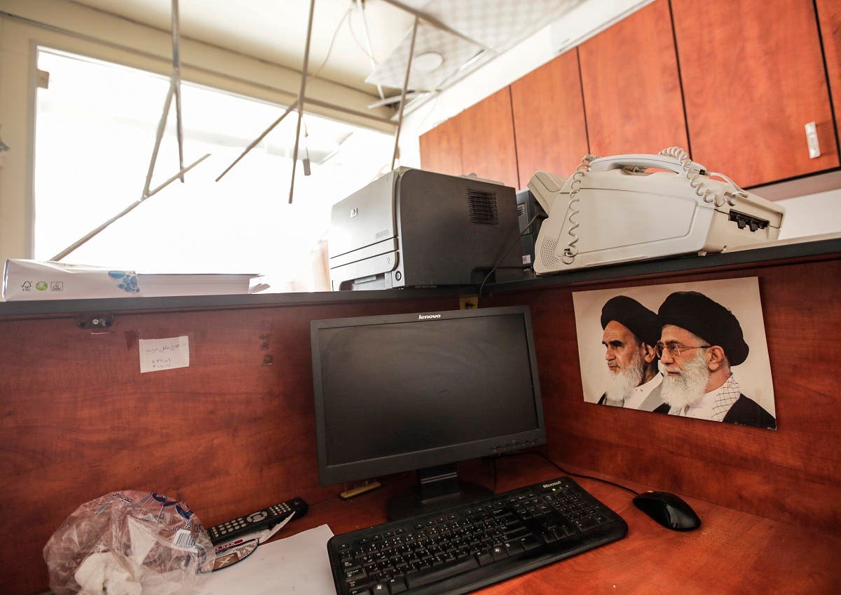 Damage inside a media center of the Lebanese Hezbollah in the south of the capital Beirut, after two drones came down in the vicinity of its building. (AFP)