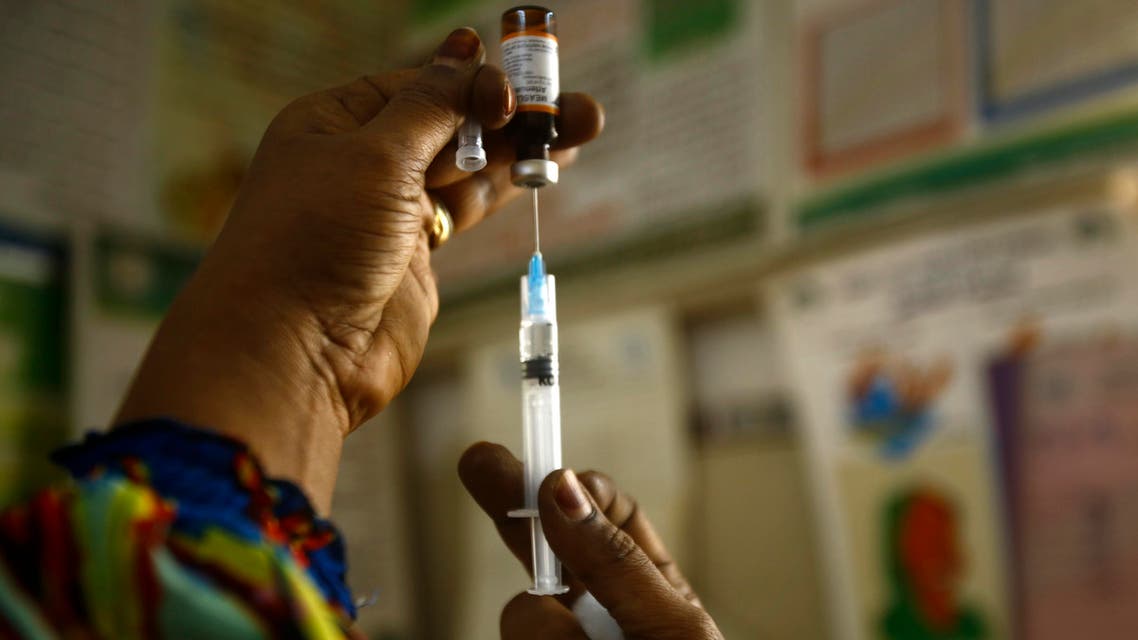 A Sudanese nurse prepares an inoculation against measles at the Samir Medical Clinic in the Sahafa neighbourhood of the Sudanese capital, Khartoum, on June 22, 2015. (AFP)