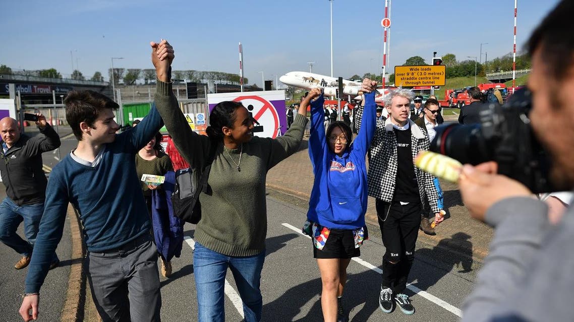 Young climate change activists leave after holding a small demonstration outside Heathrow Airport in west London. (AFP)
