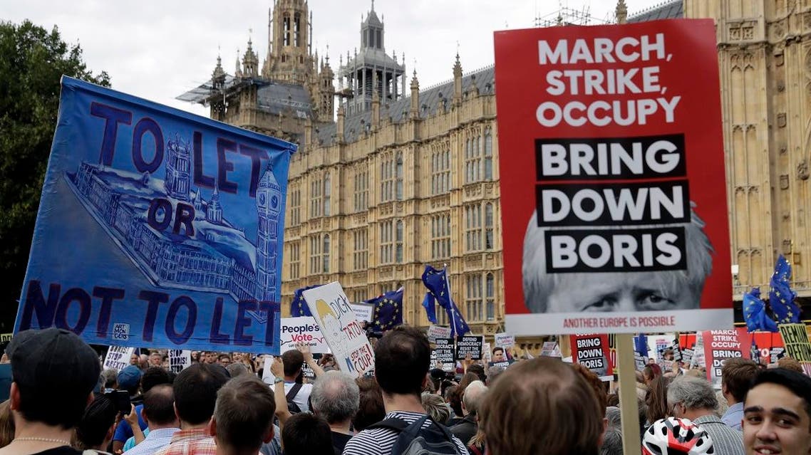 Anti-Brexit supporters take part in a protest at College Green near the Houses of Parliament in central London. (AP)