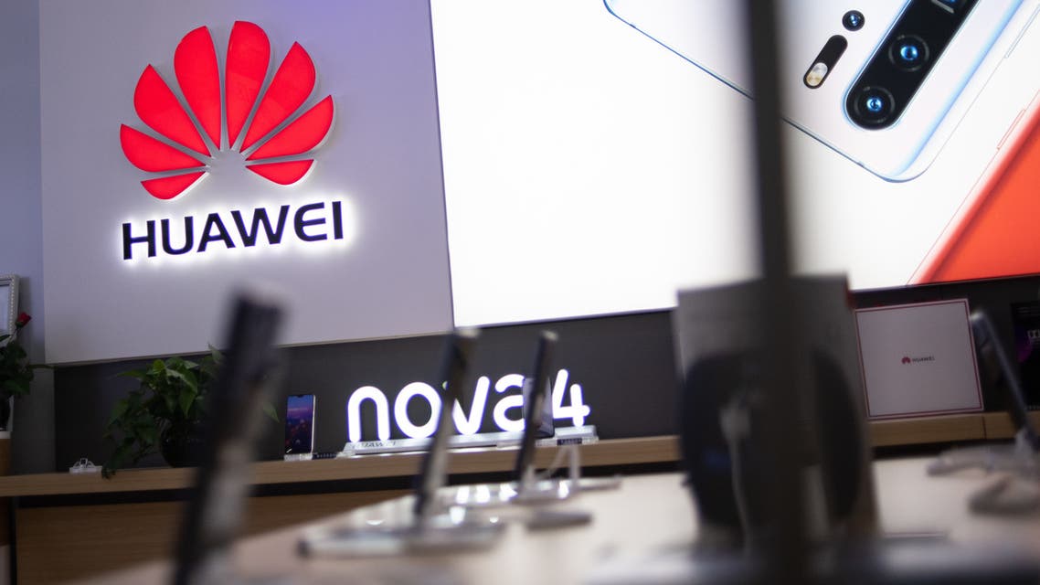 In this photo taken on May 27, 2019, a Huawei logo is displayed at a retail store in Beijing. China is digging in for a tough period of deteriorating ties with the United States, fanning the flames of patriotism with Korean War films, a viral song on the trade war, and editorials lambasting Washington.