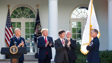 A member of the US military holds the new US Space Command flag alongside (from L) US General John W. Raymond, President Donald Trump, Secretary of Defense Mark Esper and Vice President Mike Pence during an event establishing the US Space Command in the Rose Garden of the White House in Washington, DC, on August 29, 2019. (AFP)