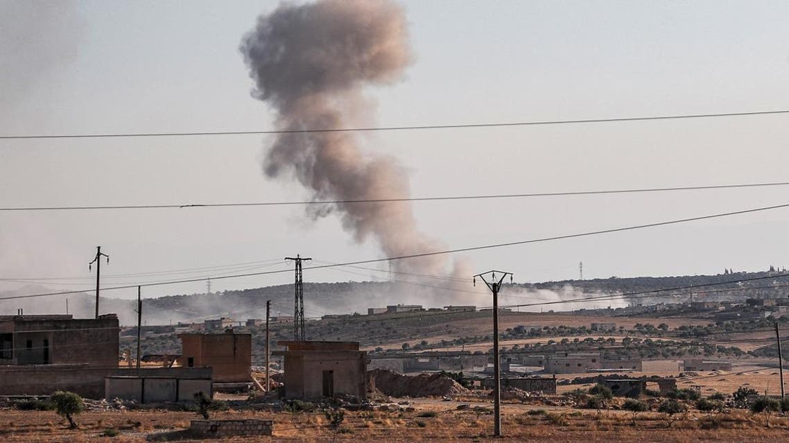 This picture taken on August 23, 2019 shows a smoke plume billowing from bombardment near the town of Maar Hitat in Syria's northern Idlib province. (AFP)