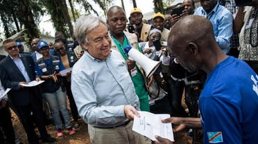 United Nation Secretary-General Antonio Guterres (L) hands a diploma to an ebola survivor during a visit to an ebola treatment centre in Mangina, North Kivu province, on September 1, 2019. (AFP)