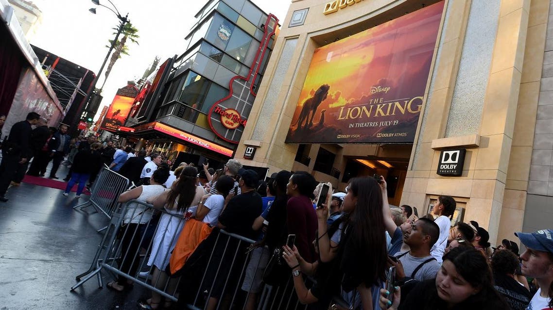 Fans wait outside the Dolby theatre as guests arrive for the world premiere of Disney's "The Lion King" on July 9, 2019 in Hollywood. (AFP)