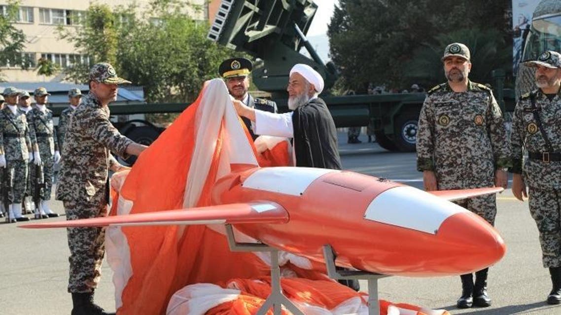 A handout picture released by the Iranian Army office on September 1, 2019, shows Brigadier-General Alireza Sabahifard (C), commander of the Army Air Defence force, unveiling a new drone dubbed "Kian" during a ceremony in the capital Tehran. (AFP)