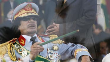 File photo of former slain Libyan leader Gaddafi gestures with a green cane as he attends a military parade in Green Square in Tripoli celebrating the 40th anniversary of the 1969 military coup. (File photo: AP)