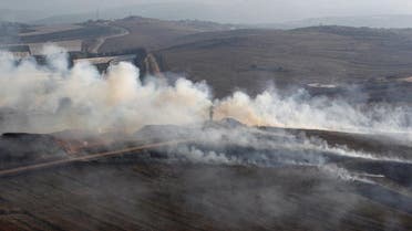 Smoke rises from shells fired from Israel in Maroun Al-Ras village, near the border with Israel, in southern Lebanon. (Reuters)