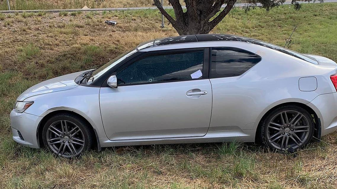 This handout images obtained courtesy of Ernst Villanueva taken on August 31, 2019 show a car with a bullet hole on the windows after a gunman open fire in the I-20 highway in between Odessa and Midland, Texas. (AFP)