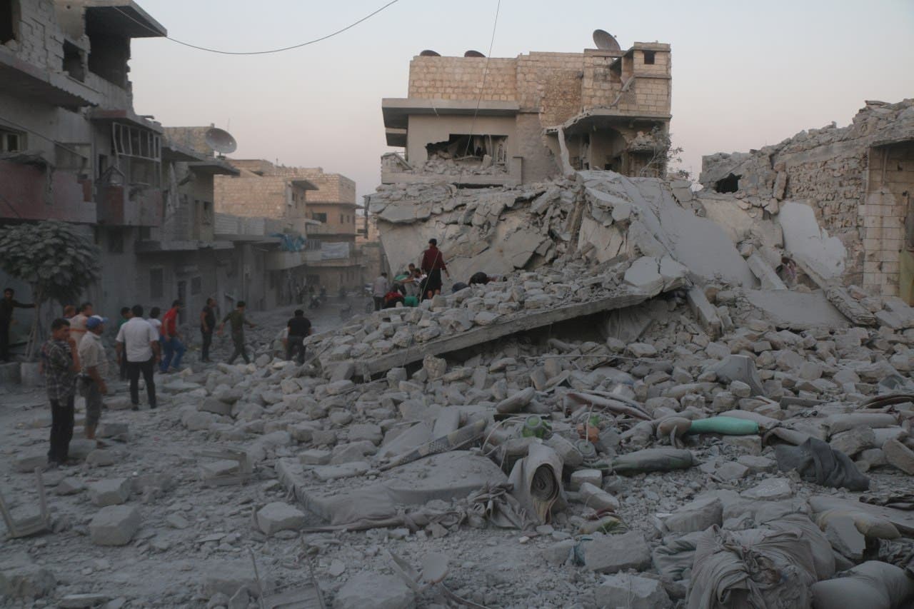 Residents inspect the rubble of damaged buildings, looking for victims, after a deadly airstrike, said to be in Maarat al-Numan, Idlib province, Syria August 28, 2019. (Reuters)