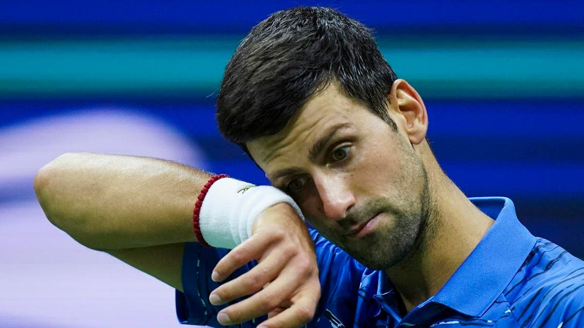 Novak Djokovic, of Serbia, reacts after losing a point against Stan Wawrinka, of Switzerland, during round four of the US Open. (AP)