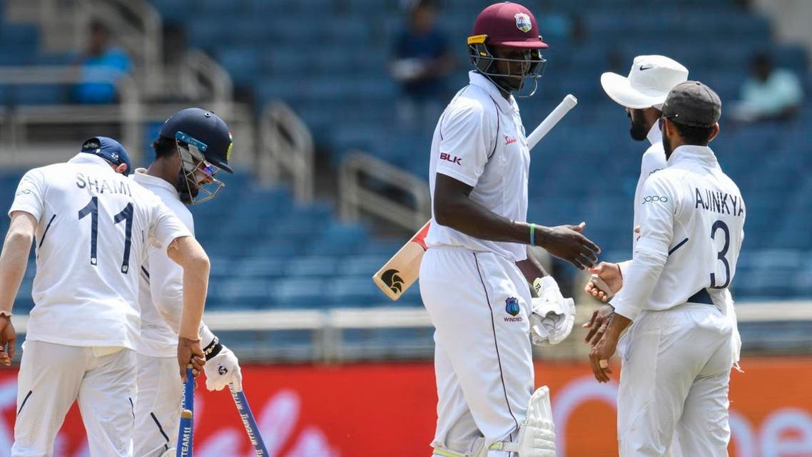 Jason Holder (2R) of West Indies congratulate Ajinkya Rahane (R) of India for winning on day 4 of the 2nd Test at Sabina Park, Kingston, Jamaica, on September 2, 2019. (AFP)