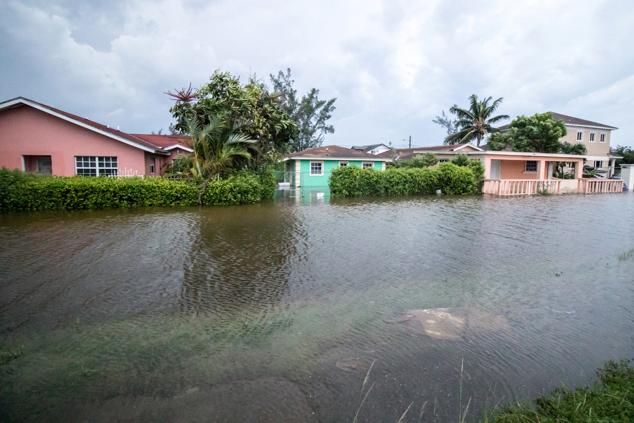 Houses line a flooded street after the effects of Hurricane Dorian arrived in Nassau, Bahamas, September 2, 2019. REUTERS