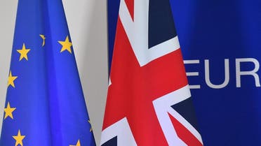 A European Union flag and a UK flag are pictured during a special meeting of the European Council to endorse the draft Brexit withdrawal agreement and to approve the draft political declaration on future EU-UK relations on November 25, 2018 in Brussels. (AFP)