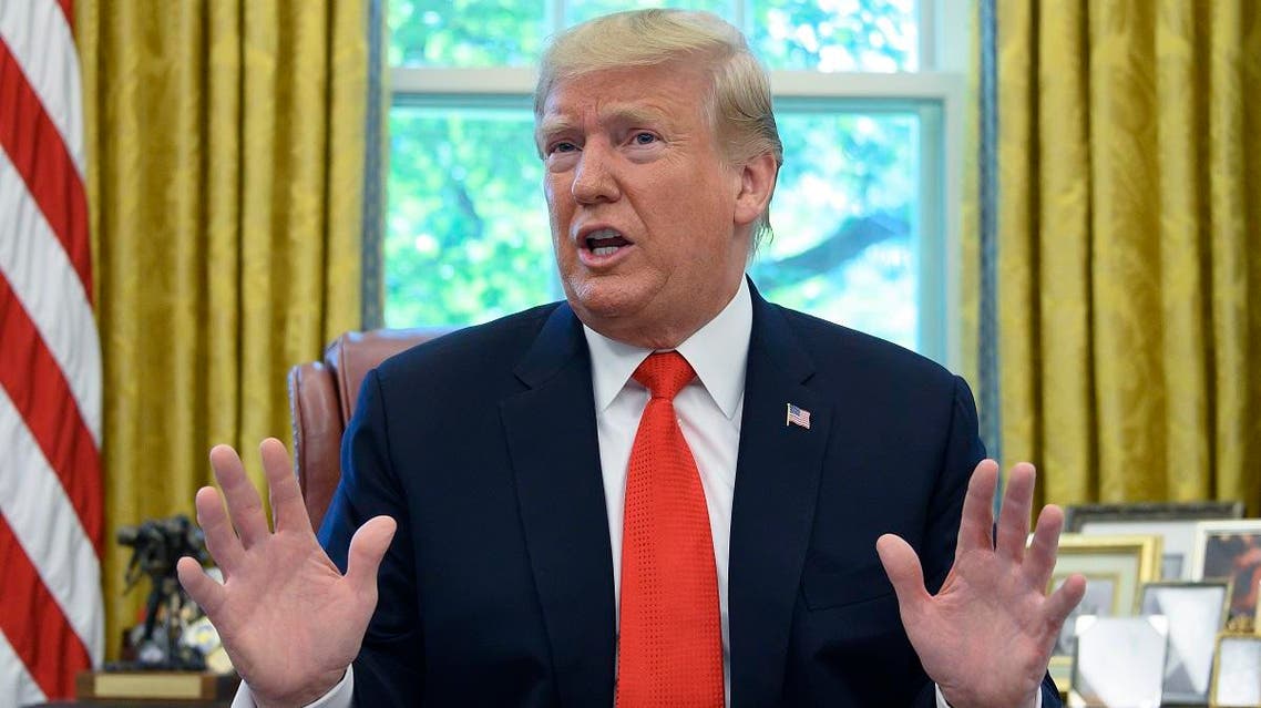 US President Donald Trump updates the media on Hurricane Dorian preparedness from the Oval Office at the White House in Washington, DC, September 4, 2019. (AFP)
