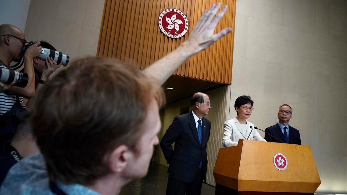 Hong Kong Chief Executive Carrie Lam (second from right), speaks during a press conference at the government building in Hong Kong, on September 5, 2019. (AP)
