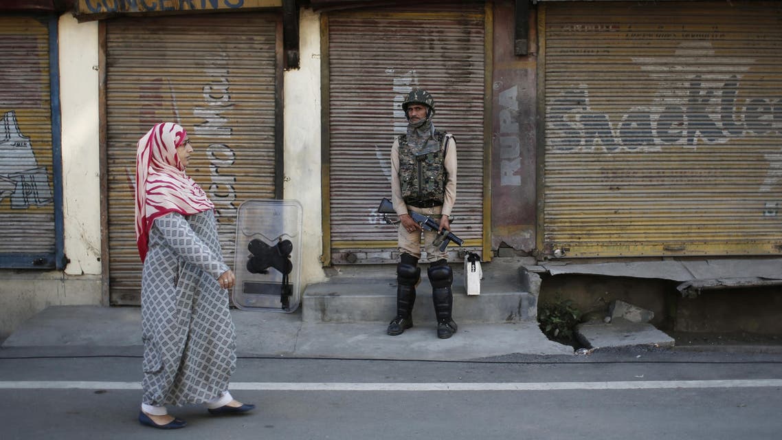 Kashmir Indian soldier woman street - Reuters