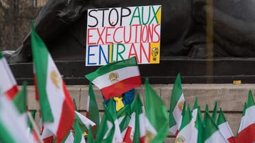 Stop executions in Iran protest in France flag - AP