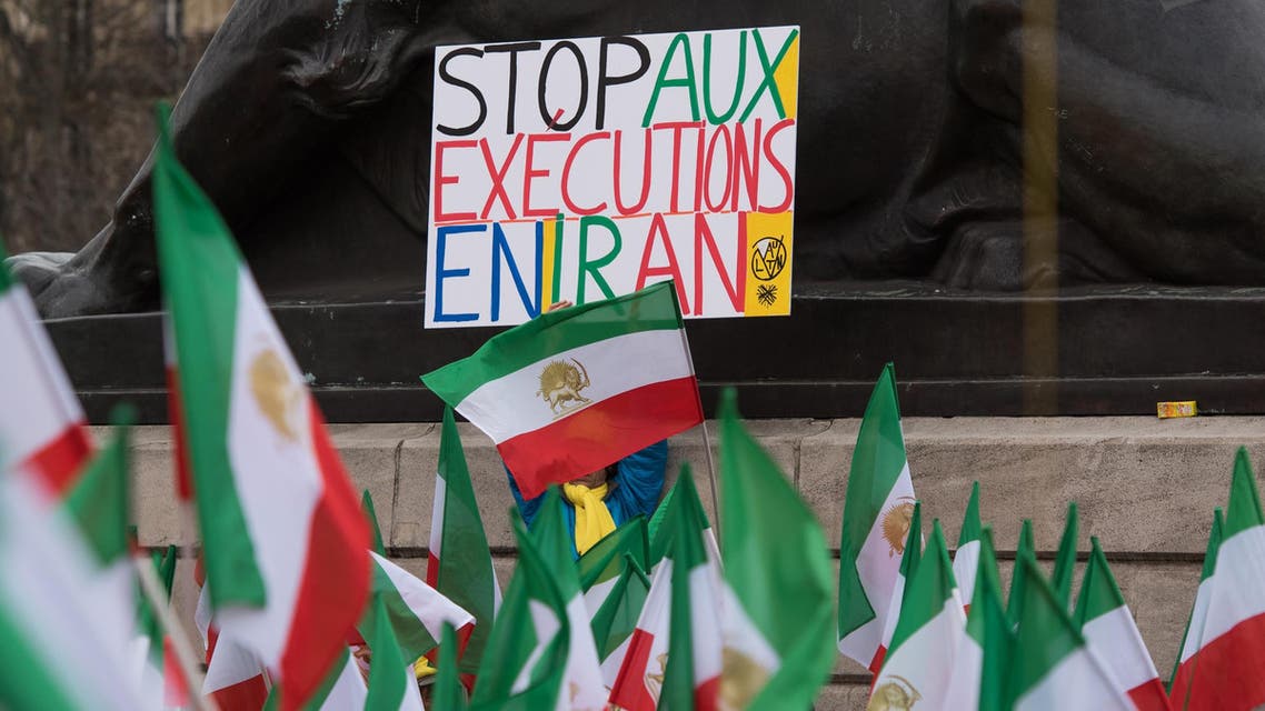 Stop executions in Iran protest in France flag - AP